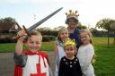 George Marshall dressed as St George with teacher Miss Baker, Chloe Grace, Ruby Powell and Chloe Cribbins as Queens and Kate Middleton
