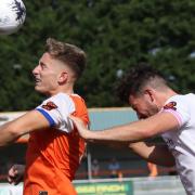 Heads up: Will Davies leaps for a header for Braintree Town in their draw with Farnborough.
