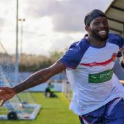Smiles: Josh Osude celebrates after scoring for Witham Town against Walthamstow.