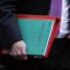 Chancellor George Osborne holds his 2011 autumn statement document as he heads to the Commons