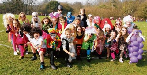 Year Five and Six pupils join staff at Great Bradfords Junior School, Marlborough Road, Braintree, in fancy dress for Sport Relief mile for charity at the school on Friday.
