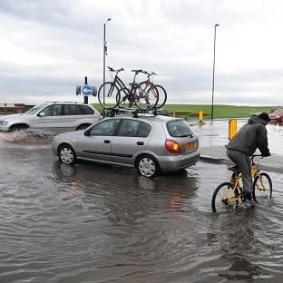 Flooding in Whitley Bay, North Tyneside, as heavy rain and thunderstorms battered parts of central and northern England