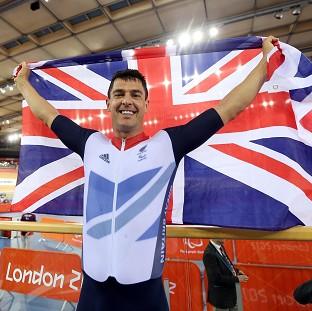 Mark Colbourne celebrates his gold medal-winning ride in the Olympic velodrome