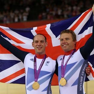 Anthony Kappes, left, and Craig Maclean celebrate winning gold in the men's individual B sprint