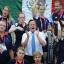 Prime Minister David Cameron and ParalympicsGB athletes watch Great Britain swimmer Ellie Simmonds win a gold medal