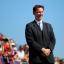 Health Secretary Jeremy Hunt waits to present the medals for the women's individual H 1-3 road race and was subsequently booed