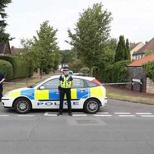 Police close to the home of Saad al-Hilli in Claygate, Surrey