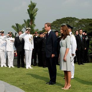 The Duke and Duchess of Cambridge pay their respects at the Kranji War Memorial in Singapore (AP)