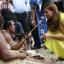 The Duchess of Cambridge talks to a woman in traditional outfit in Honiara, Solomon Islands (AP/Daniel Munoz)