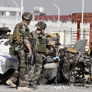 French soldiers at the scene of the suicide bombing in Kabul, Afghanistan (AP)