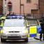 Armed police on the streets as a police van believed to be carrying Dale Cregan leaves Manchester Magistrates' Court