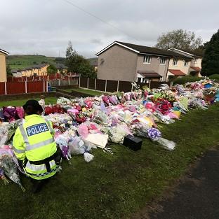 A vigil has been held close to the crime scene in Abbey Gardens, Tameside, where two police officers were shot