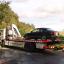 A car being taken away from the scene in Hampshire where a man and two children were found dead