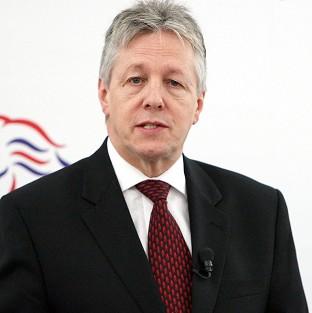 First Minister Peter Robinson has condemned the killing of a prison officer on his way to work at Maghaberry jail