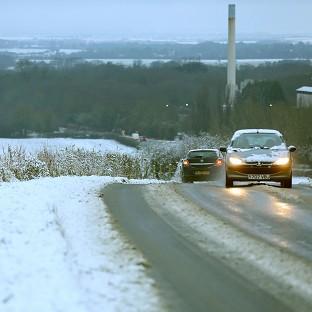 Motorists make their way through the snow at Barrington in Cambridgeshire