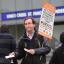 A rail campaigner demonstrates outside King's Cross station in London on the day fares go up
