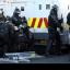 A police officer is injured after loyalist protesters attacked police lines at the Albertbridge Road near the nationalist Short Strand area of Belfast