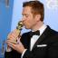 Damian Lewis kisses his award for best performance by an actor in a television series drama for Homeland (Jordan Strauss/Invision/AP)