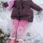 Three-year-old Grace Southgate making a snow angel Three-year-old Grace Southgate making a snow angel