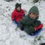 Daniel and Xander Regan, aged five and one, trying out their new sledge at home in Laburnum Way, Witham. Daniel and Xander Regan, aged five and one, trying out their new sledge at home in Laburnum Way, Witham.