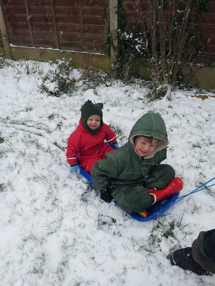 Daniel and Xander Regan, aged five and one, trying out their new sledge at home in Laburnum Way, Witham.
