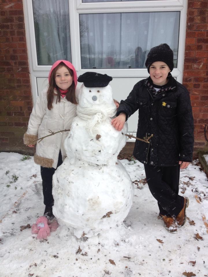 Aaron and Ami Evans with their snowman in Witham