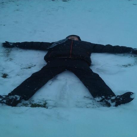 Matthew Williams making a snow angel in Witham
