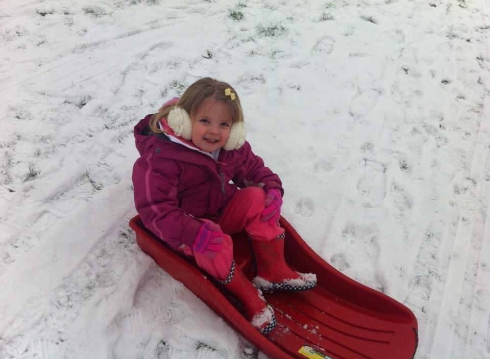 Olivia Green, three, enjoys the snow in Braintree