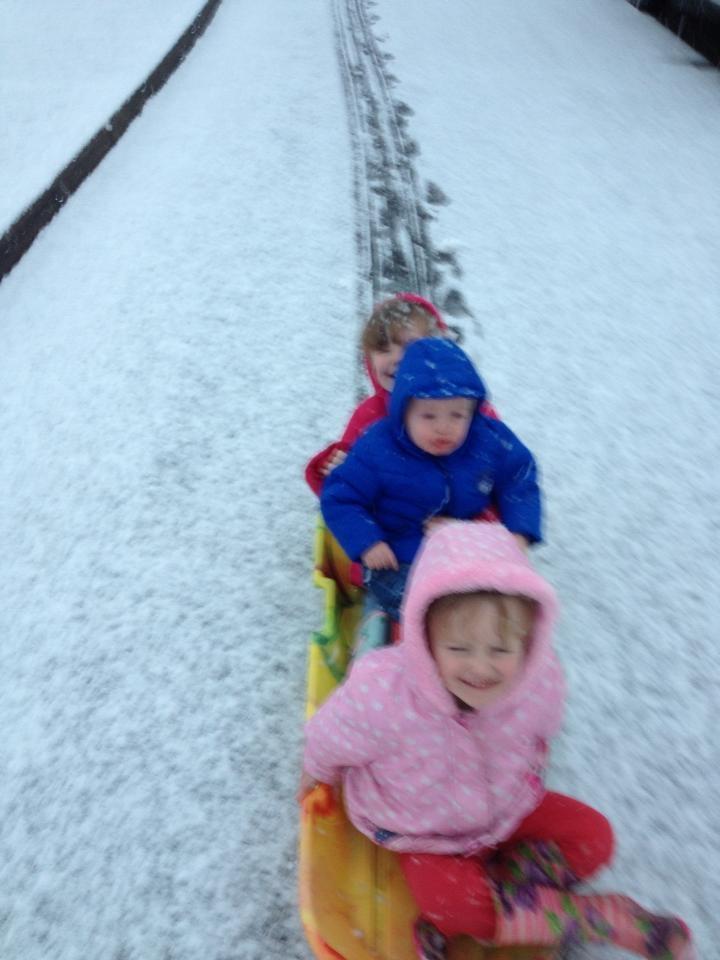 Eboni, Amy and Bobby Barty sledging in Sible Hedingham