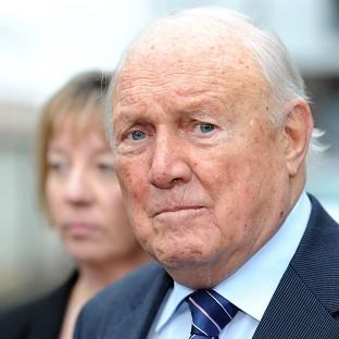 Former TV presenter Stuart Hall reads a statement outside Preston Magistrates' Court
