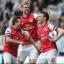 Laurent Koscielny, right, was on target minutes after the break as Arsenal claimed the final Champions League spot