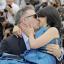 Alec Baldwin carries and kisses his pregnant wife Hilaria Thomas on the red carpet at Cannes