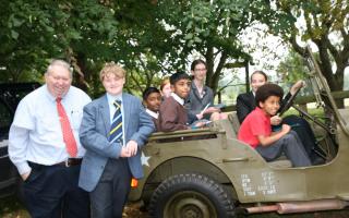 Dr Vernon Williams pictured with Shalford schoolchildren on the day (Pictures: Gary Mills and John Smith)