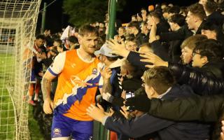 Great night: Braintree Town's Joe Grimwood celebrates with the club's jubilant fans following their 1-0 play-off eliminator win over Bath City, on Tuesday night.