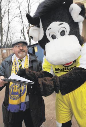 The Braintree Town mascot signs the petition for a new football stadium complex
