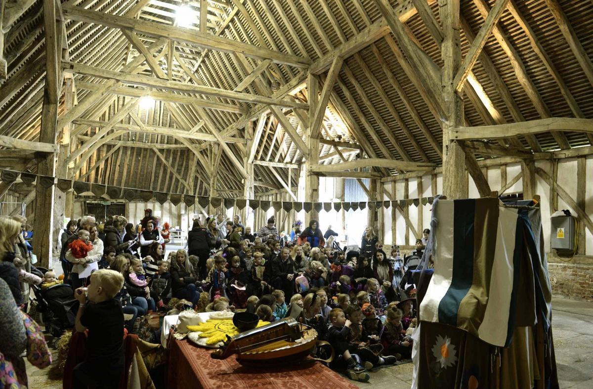 Atmospheric - crowds enjoy a puppet show at Cressing Temple Barns