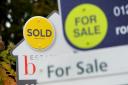 File photo dated 14/10/14 of sold and for sale signs. Commuter belt areas surrounding London are particularly benefiting from a surge in house hunter inquiries following last week's stamp duty cut, according to analysis. Chancellor Rishi Sunak