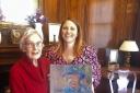 Marion Danes and Braintree Council venue manager Jenny Mayes with the painting of Queen Elizabeth II