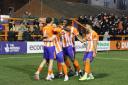 Late show: Braintree Town's goalscorer Baris Altintop celebrates with his team-mates after scoring a stoppage-time winner against Bath City. Picture: JON WEAVER