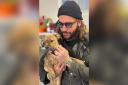 Pete Wicks holding mastiff puppy Piper who is looking for a new home