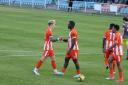 Well done - Braintree Town's George Quantrell (left) congratulates goalscorer Nnamdi Nwachuku at Canvey Island