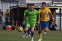 Tussle: Braintree Town's Alfie Payne (green shirt) battles for the ball against Canvey Island.
