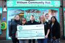 Donation -  Back row, from left: Braintree Councillors Jon Hayes, Toby Williams and Ethan Williams. Front Row: Tina Townsend and Karen Bailey, Trustees of The Witham Hub with Cllr Sindhu Rajeev