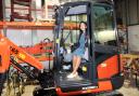Visit -Priti Patel MP at the controls of an excavator at Dale Hire during her tour
