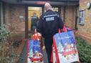 PC James Draper delivers donated gifts to a Braintree primary school last year