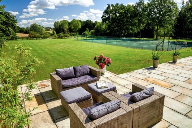 Braintree and Witham Times: Spacious - outside you will find plenty of garden space, alongside a tennis court and seating area