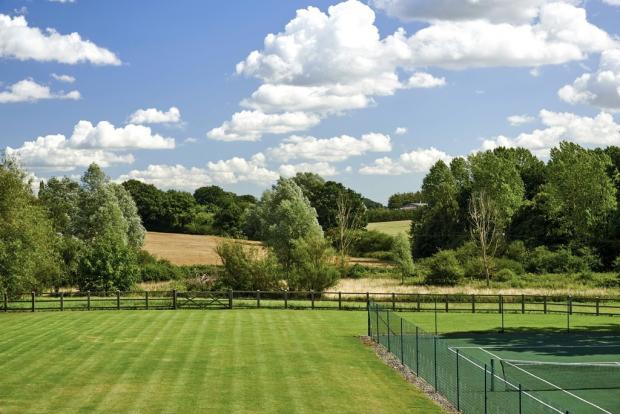 Braintree and Witham Times: Let's play - the garden has plenty of space and a tennis court for some sport