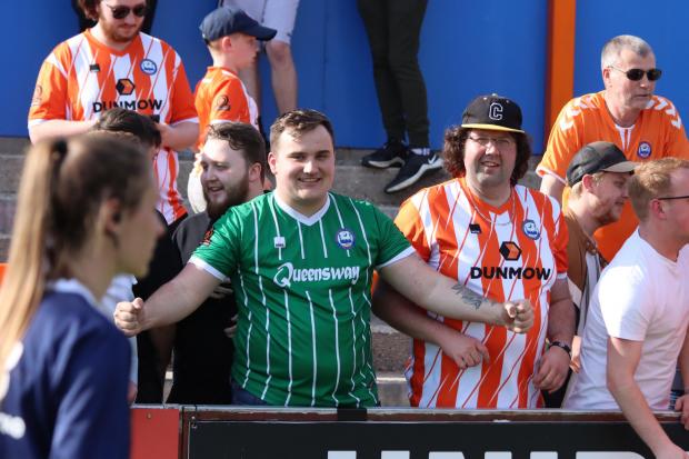 Staying up: Braintree Town fans are all smiles during their team's 3-1 win against Hemel Hempstead Town, which secured their National League South status for another season. Picture: JON WEAVER