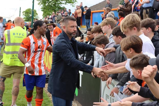 Moving on - Ryan Maxwell thanks the Braintree Town fans following their final game of the National League South season against Billericay Town, last Saturday Picture: JON WEAVER
