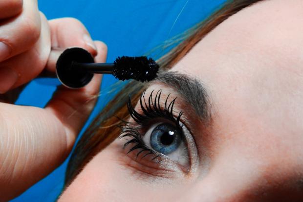 Braintree and Witham Times: A woman putting on mascara. Credit: Canva
